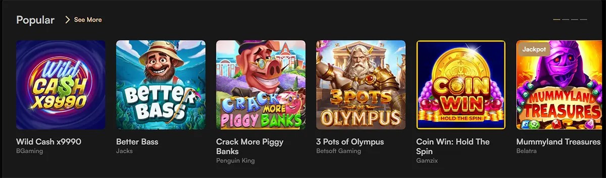 Popular casino games section featuring Wild Cash x9990, Better Bass, Crack More Piggy Banks, 3 Pots of Olympus, Coin Win: Hold The Spin, and Mummyland Treasures, with a “See More” link on a dark interface.