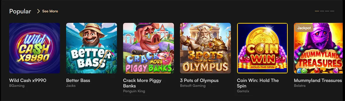 Popular casino games section featuring Wild Cash x9990, Better Bass, Crack More Piggy Banks, 3 Pots of Olympus, Coin Win: Hold The Spin, and Mummyland Treasures, with a “See More” link on a dark interface.